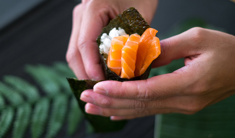 Temaki (hand roll) with salmon and rice