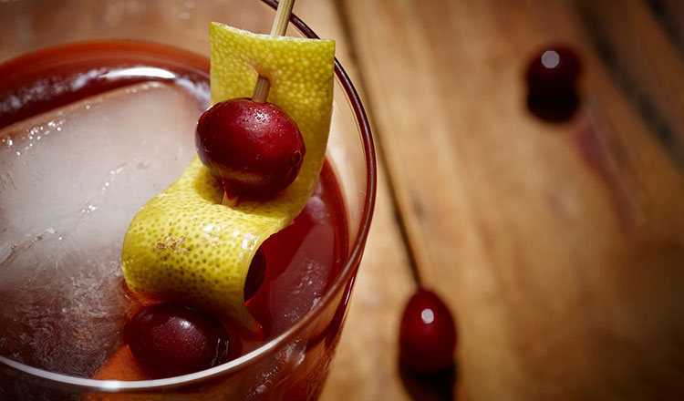 Cranberry Shrub in a glass with ice