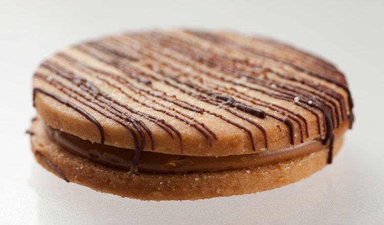 Chocolate-drizzled alfajores