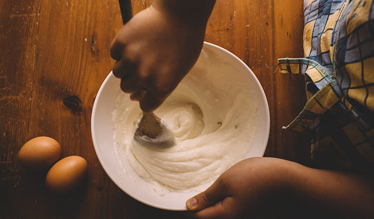 Mixing cake batter in a bowl