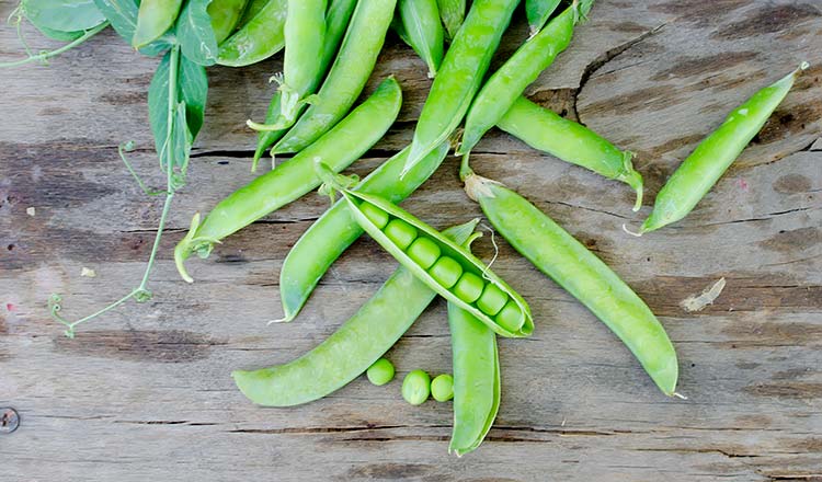 shelling peas on wood