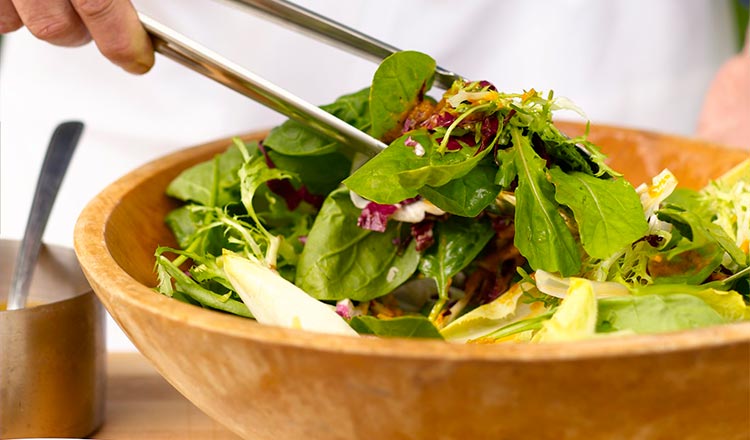 Salad tossed in bowl