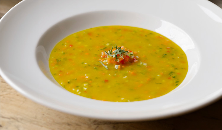 Yellow Tomato Gazpacho in a white bowl