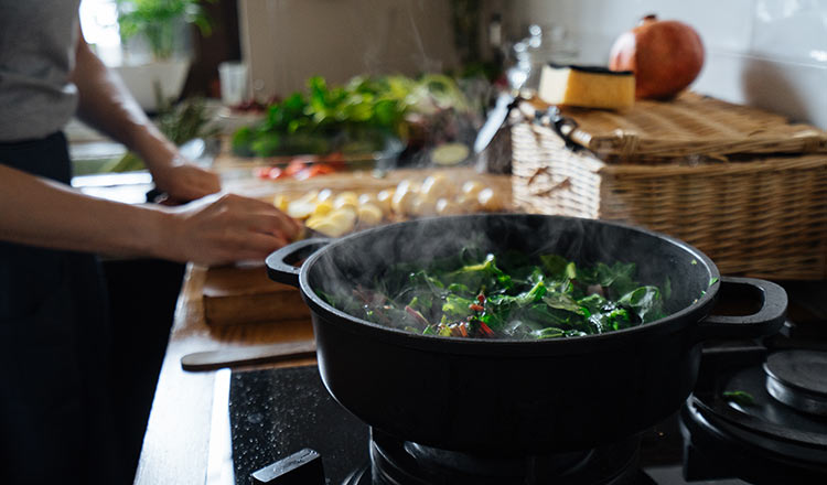 Cooking greens on a stovetop