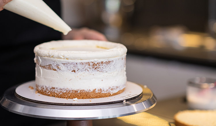 layer cake being iced