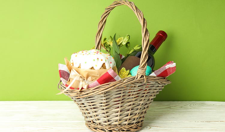 Gift basket in front of a bright green background.