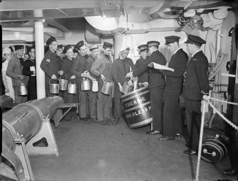 British Navy men waiting in line for their rum ration.