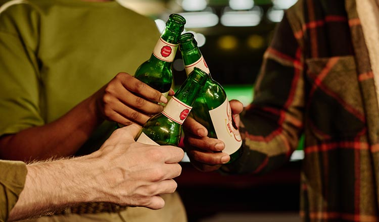 Cheers with beer bottles 