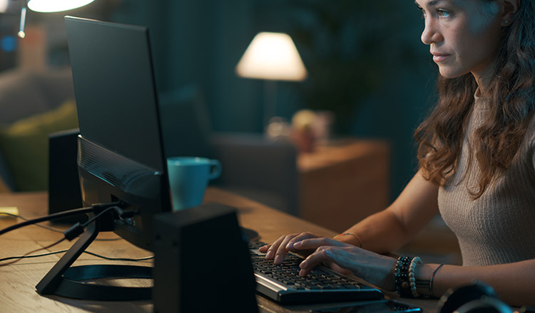 Woman sitting at computer