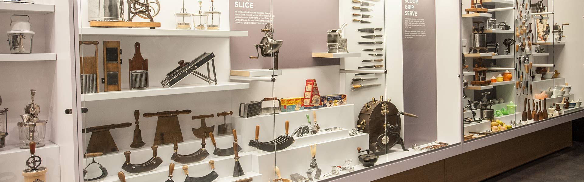 Interior of Chuck Williams Culinary Arts Museum showcasing historic cookware, tools, and kitchen artifacts.