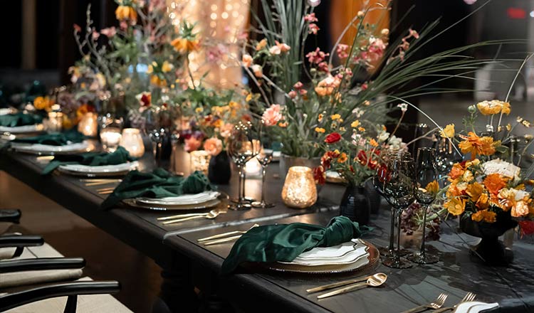 CIA at Greystone wedding table with elegant place settings, floral arrangements, and candlelight.